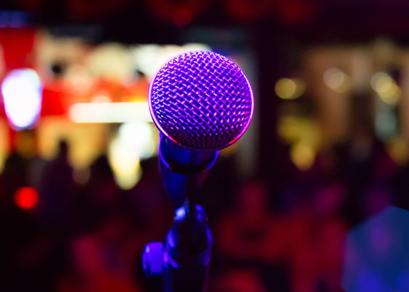 live pic close up pic of a microphone in a purple light